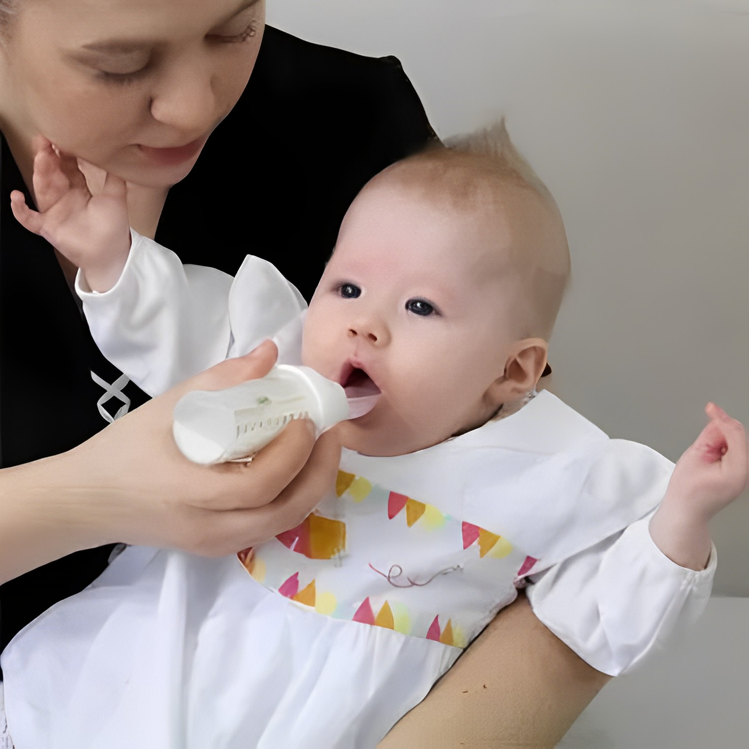 Spoon Feeding Breastmilk to a Newborn 