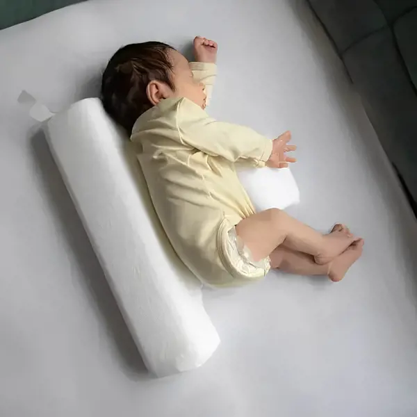 Pillow to help baby sleep on side best sale